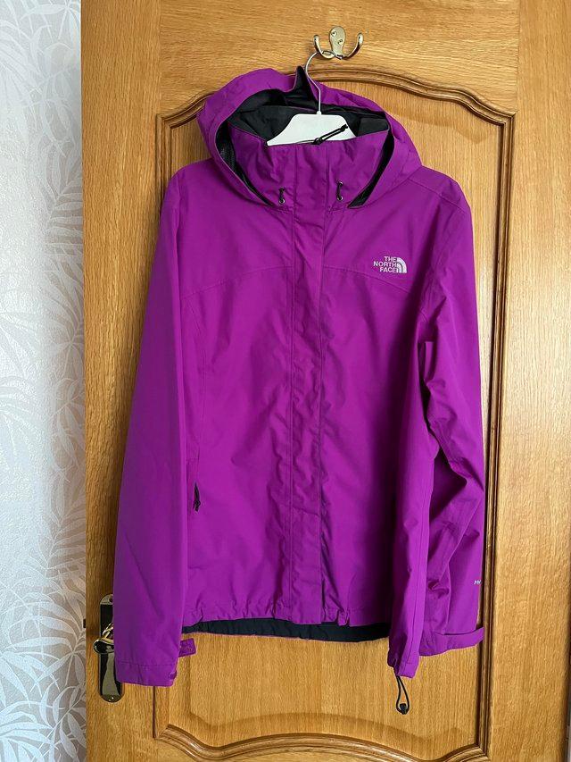 Preview of the first image of The North Face ladies rain coat..