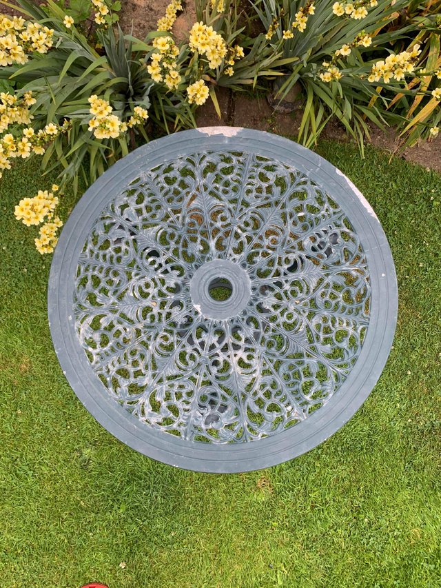 Preview of the first image of Charming ornate metal garden table.
