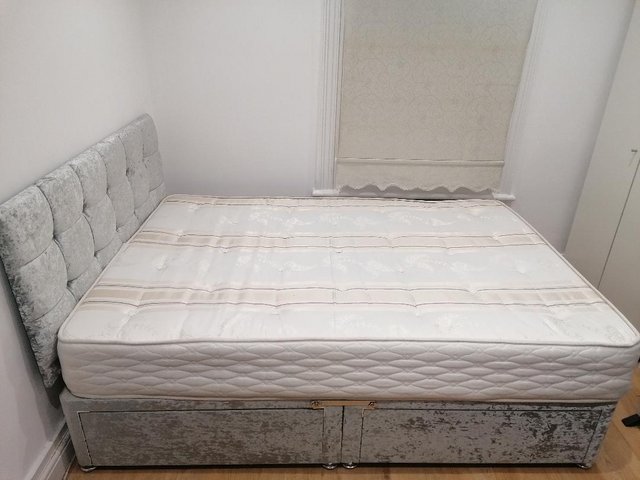 Preview of the first image of Double bed with mattress, headboard and 4 drawers.
