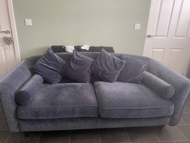 Preview of the first image of DFS dame/navy 3 seater sofa and matching cuddle armchair.