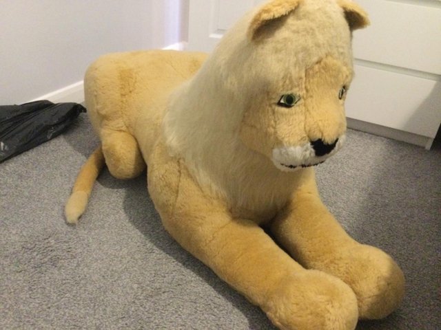 Preview of the first image of An Antique Large Stuffed Lion.