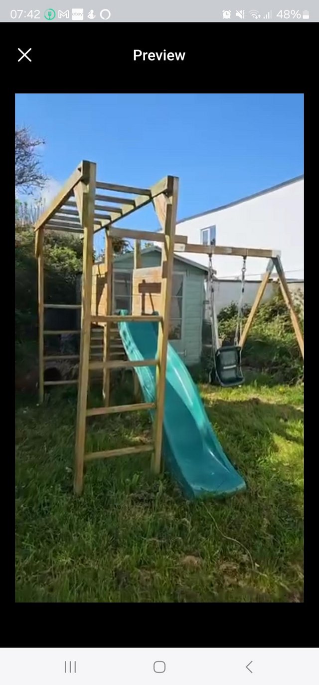 Preview of the first image of Wooden climbing frame play centre garden slide swings monkey.