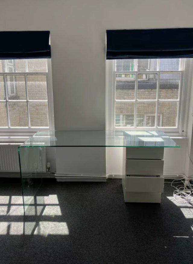 Preview of the first image of Modern solid glass desk with white 4 drawer storage home off.