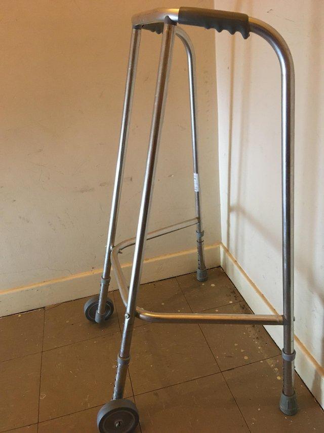 Preview of the first image of Adult walking frame with two front wheels like new.