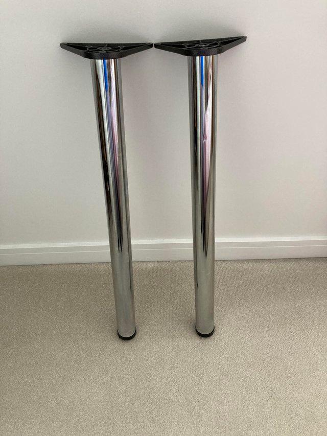 Preview of the first image of Pair of chrome plated adjustable breakfast bar legs.
