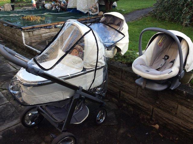 Preview of the first image of Baby leather pram pushchair and baby chair all with covers.