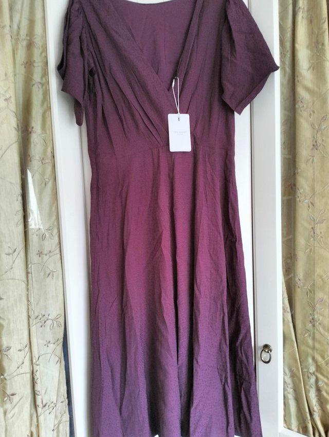 Preview of the first image of Ted Baker tea dress fully lined.