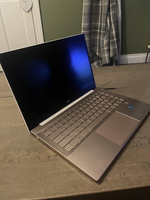 Preview of the first image of Hp pavilion white and rose gold touch screen laptop.
