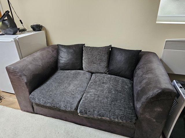 Preview of the first image of Black 2 seater sofa for sale.