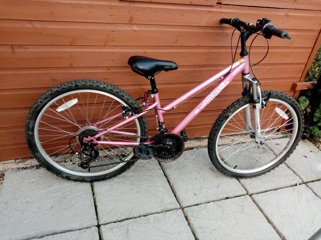 Preview of the first image of MOUNTAIN BIKE APOLLO VIVID BIKE PINK 24"WHEELS.