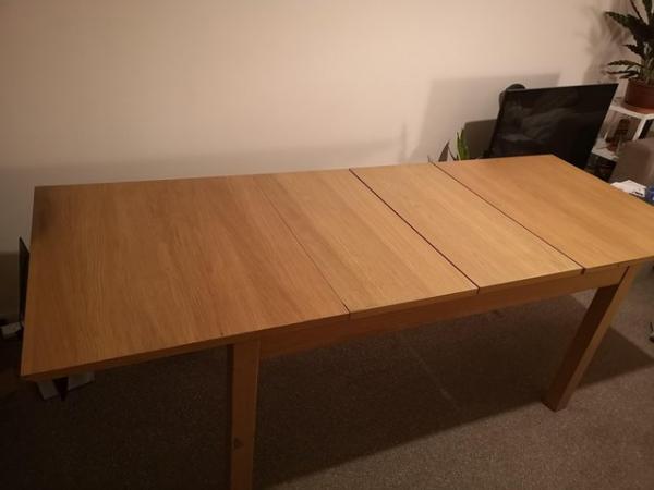 Image 3 of Solid oak extendable wood dining table on half price