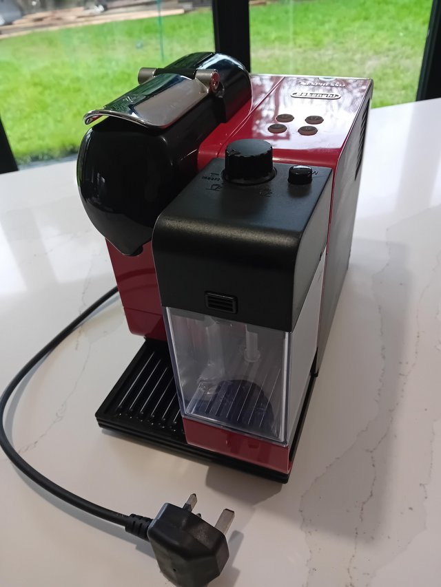 Preview of the first image of Red Delonghi coffee machine.