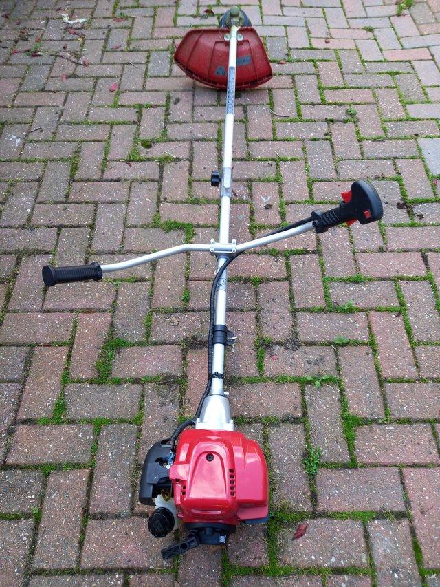 Preview of the first image of Petrol 4 stroke strimmer good condition.
