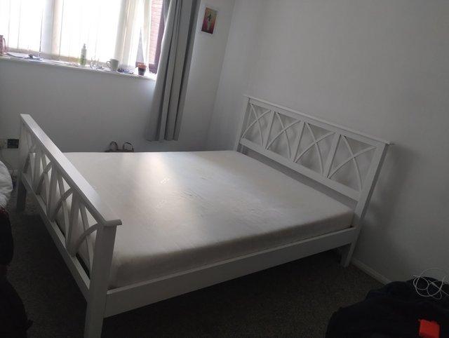 Preview of the first image of King size bed and mattress. Good condition and comfortable..