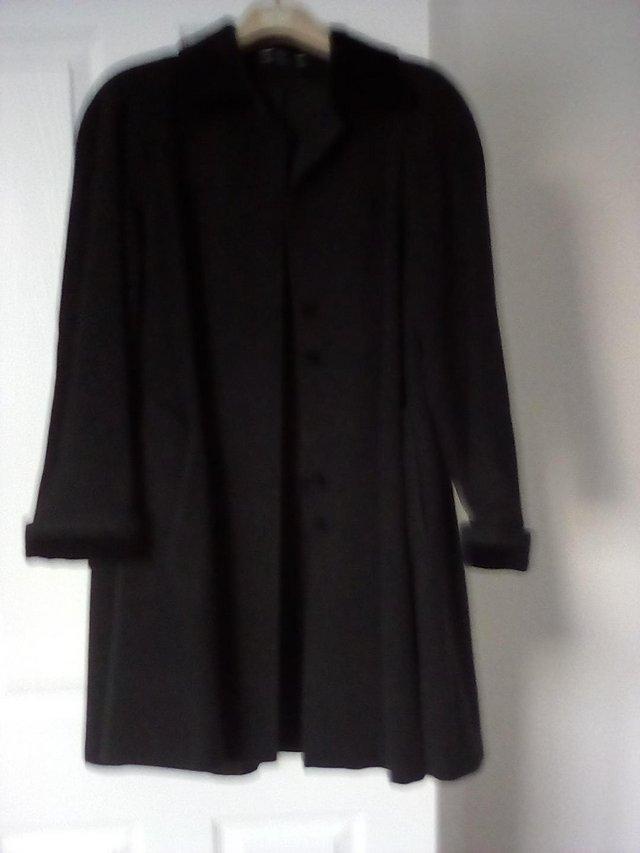 Preview of the first image of Ladies Black Swing Type Coat Size 10.