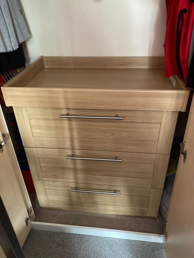 Preview of the first image of Mamas and papas changing table with draws.