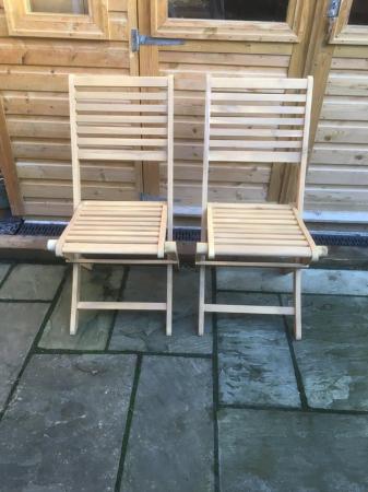 Image 1 of Two identical and unused Newbury garden chairs,