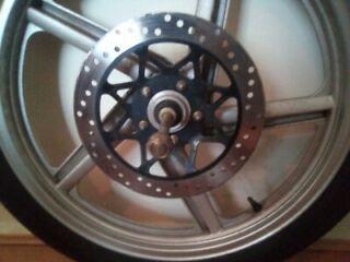Preview of the first image of Motorcycle wheel off a 125cc all inclusive..