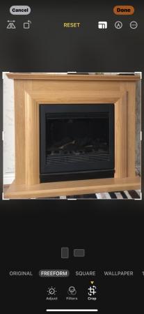 Image 1 of Electric fire with oak surround excellent condition