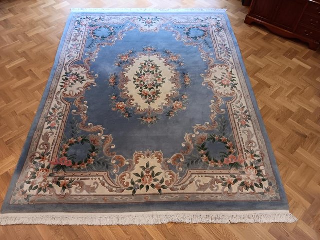 Preview of the first image of Large pale blue floral wool Chinese rug 10’ x 8’.