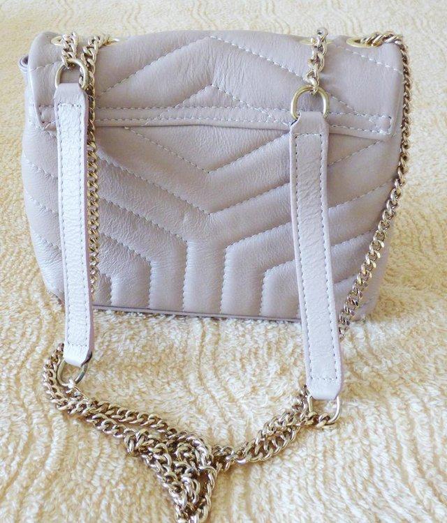 Preview of the first image of NEW REAL LEATHER DESIGNER SMALL BEIGE QUILTED BAG.
