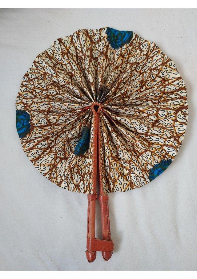Preview of the first image of Unique handmade brown fan / accessory with african fabrics.