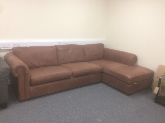 Preview of the first image of GENUINE LEATHER 4 SEATER CHAISE.