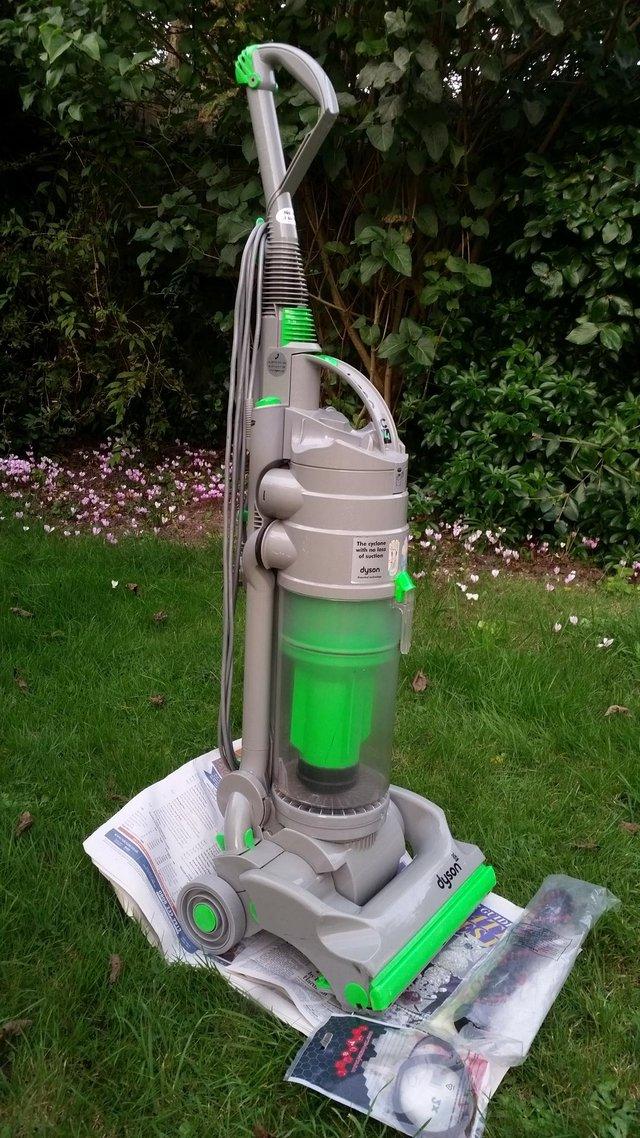 Preview of the first image of Dyson DC04 upright vacuum cleaner with tools..