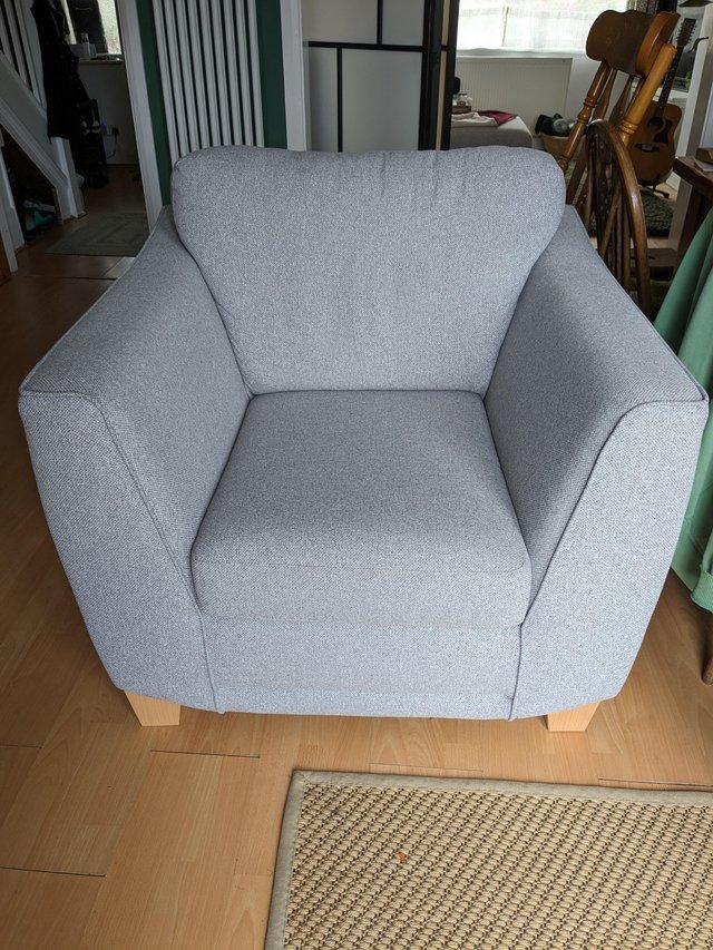 Preview of the first image of Grey armchair DFS Orlby model in silver.