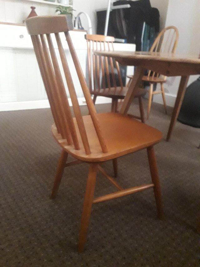 Preview of the first image of Original ercol dining table and 5 chairs.