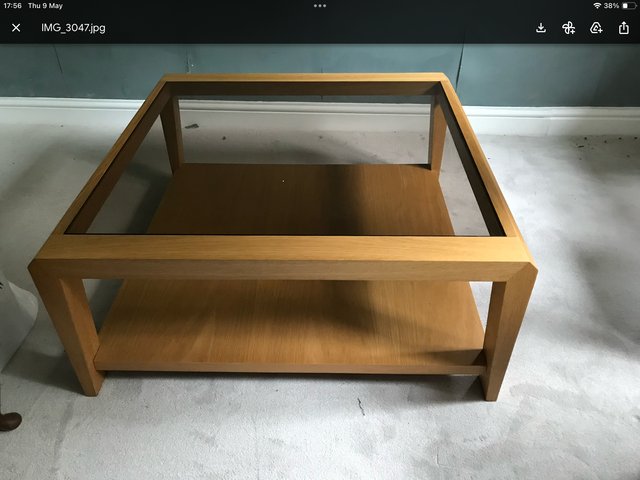 Preview of the first image of Light oak coffee table with glass top.