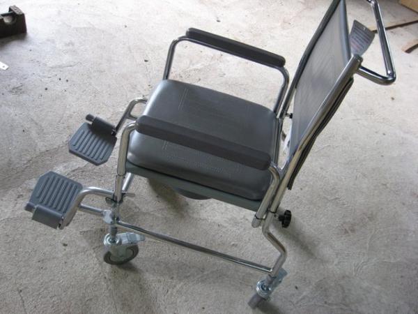 Image 2 of Portable commode doubles as a transfer chair