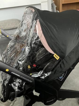 Image 1 of Doona+ car seat plus rain over and changing bag