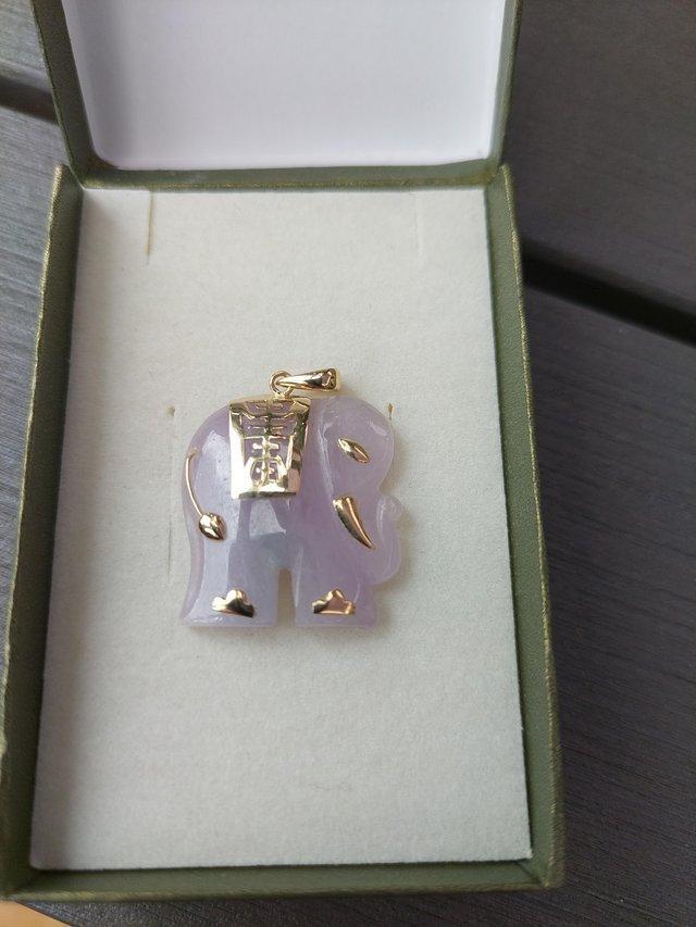 Preview of the first image of Beautiful lavender jade and gold elephant.