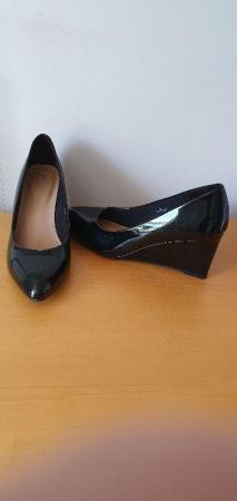 Image 1 of Ladies black patent wedge heel shoes from M&S
