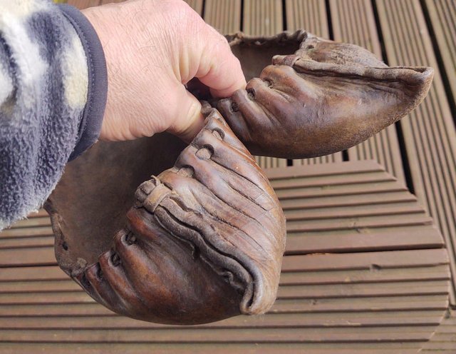 Preview of the first image of A Primitive & Unusual pair of old Leather Shoes.