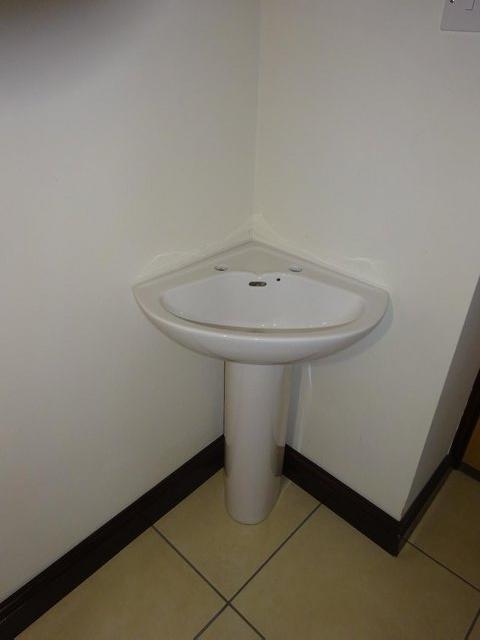 Preview of the first image of PERFECT CONDITION WHITE VANITY CORNER BASIN ON PLINTH.