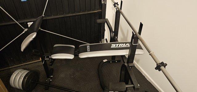Preview of the first image of Weight bench with weights.