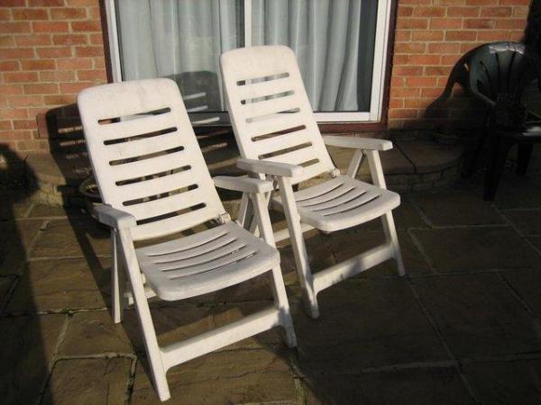 Image 3 of reclining garden chairs, quite large and white coloured.