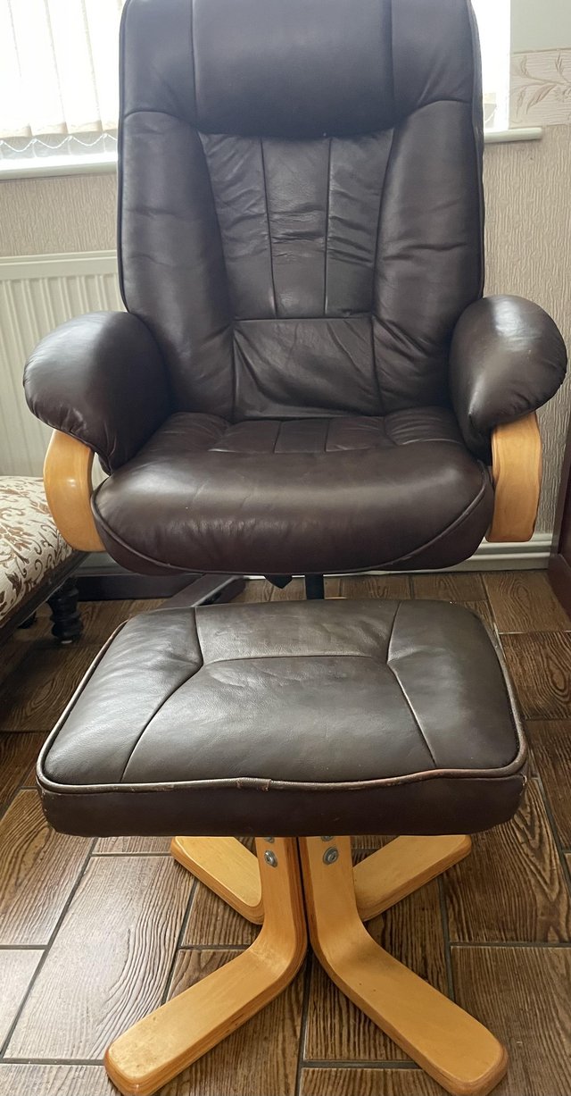 Preview of the first image of Leather recliner chair and foot stool.