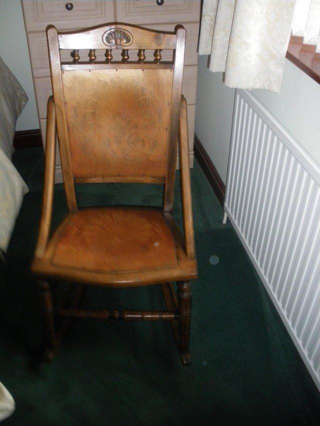 Preview of the first image of ANTIQUE ROCKING CHAIR OVER 70 YEARS OLD.