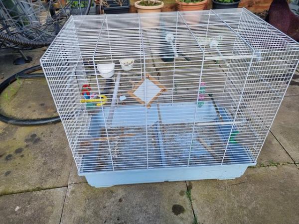 Image 6 of 2 bird cages 1 large 1 small need cleaning both good.