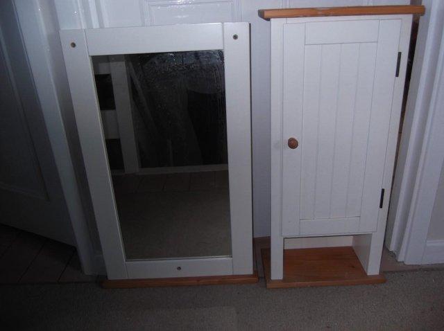 Preview of the first image of Bathroom cabinet and matching mirror.