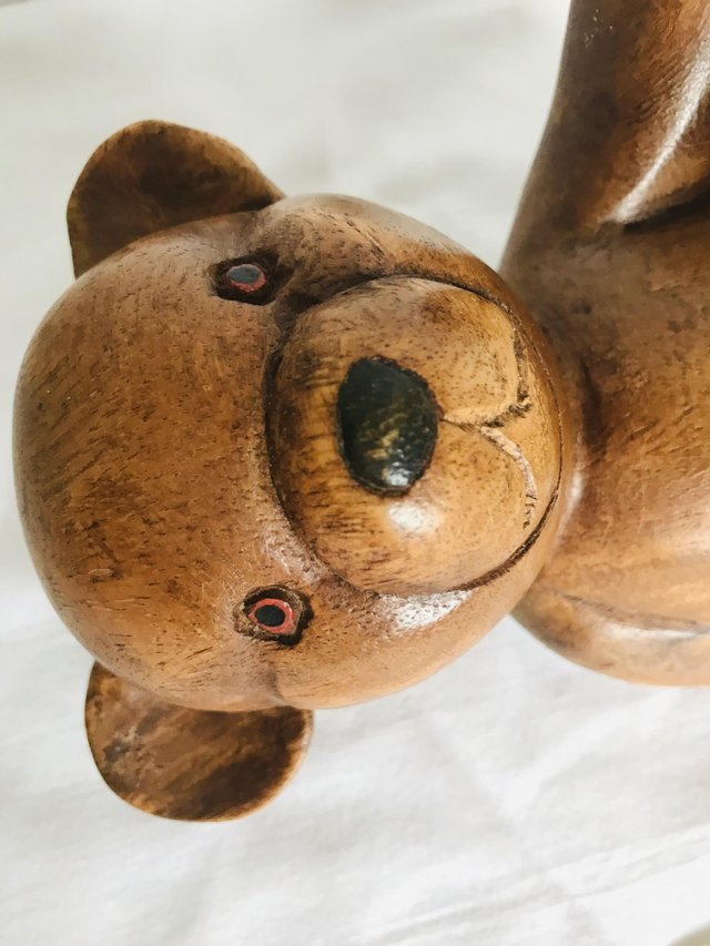 Preview of the first image of Carved solid wood teddy ornament.