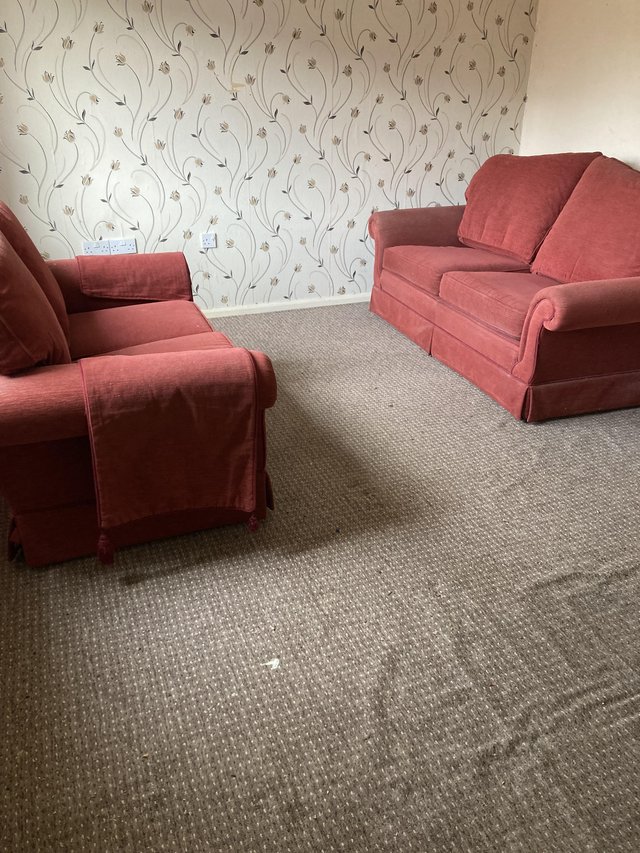 Preview of the first image of 2 sofas in reasonable condition.
