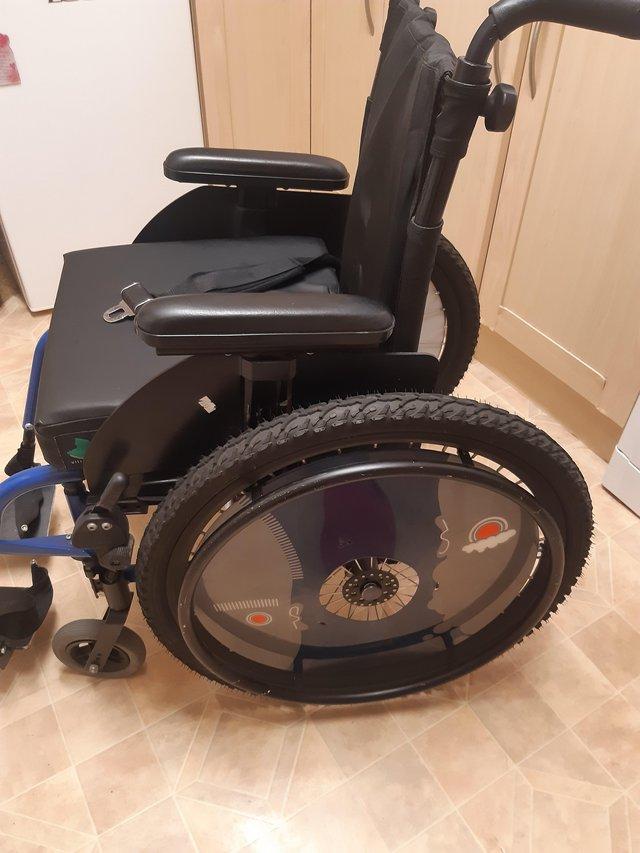 Preview of the first image of Child's wheelchair,in very good condition.