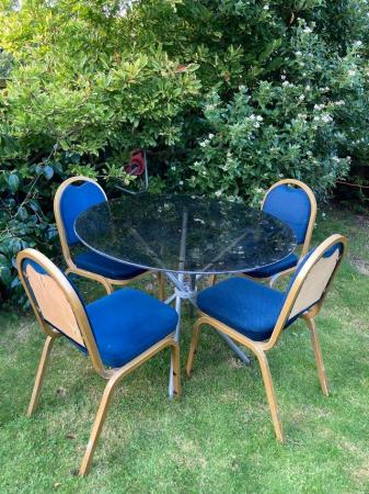 Image 3 of Thick smoked glass table and four chairs