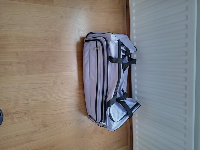 Preview of the first image of A large holdall with wheels.