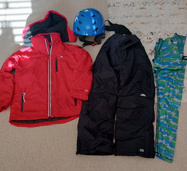 Preview of the first image of Childrens ski wear and helmet.