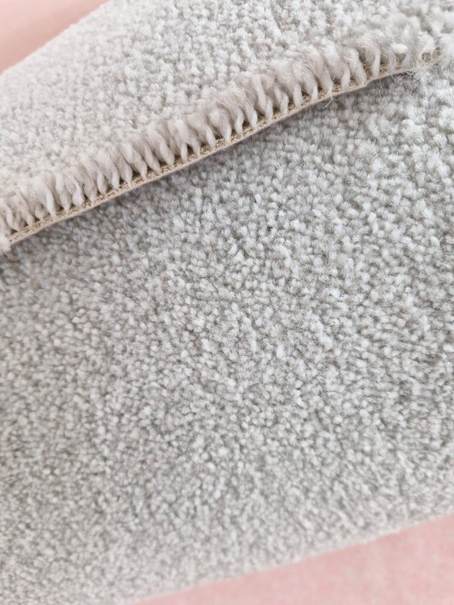 Preview of the first image of Roll of light grey carpet 5m x 3.2m twist grey felt back.